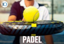 Giocatore di padel con pallina e racchetta