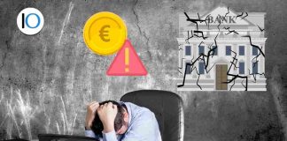 uomo con le mani nei capelli disperato per crollo banche