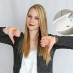 donna con i pollici in giù e un bidet nel riquadro