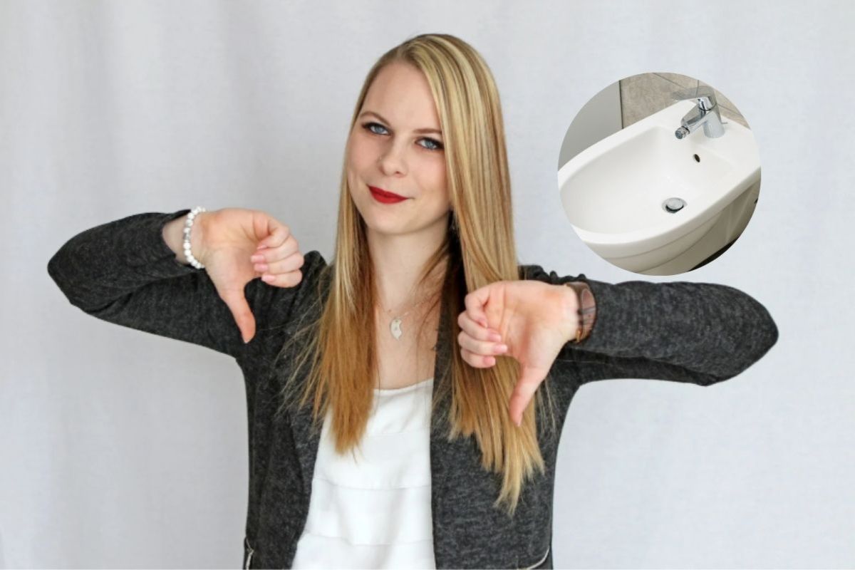 donna con i pollici in giù e un bidet nel riquadro